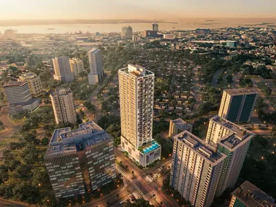 Lucima standing in Cebu Business Park at dusk, photographed from the air.