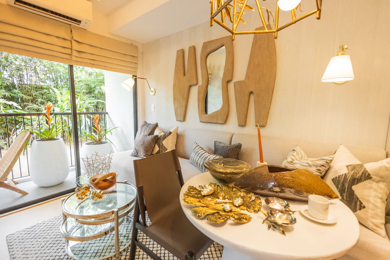 The balcony of a one-bedroom model unit at Una Apartments, opening off the dining area.